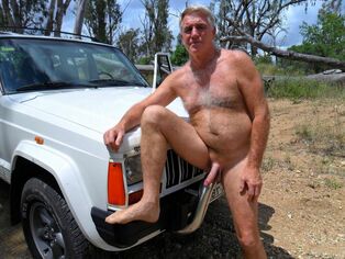 Wooly mature masculine posing naked on the nature