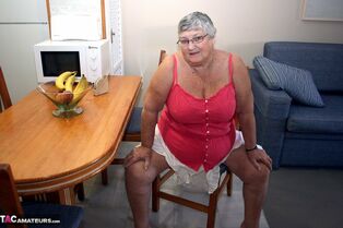 Gassy SSBBW Grannie Libby bends over naked to how off her..