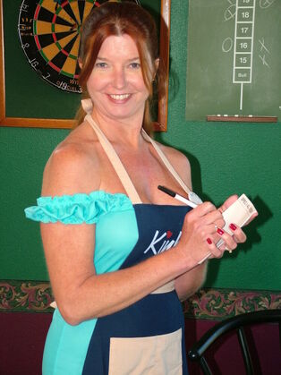 Whorey mature waitress Dee displays her ginormous bosoms..