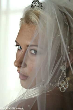 Platinum-blonde bride Katie Summers doffs her wedding dress