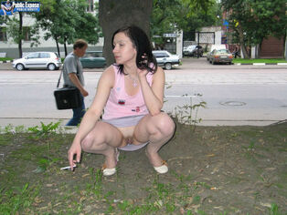 Erotically and fearlessly with her trimmed snatch in public